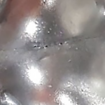 Ultra closeup of pin hole leaks detected Plate Heat Exchanger leak detection